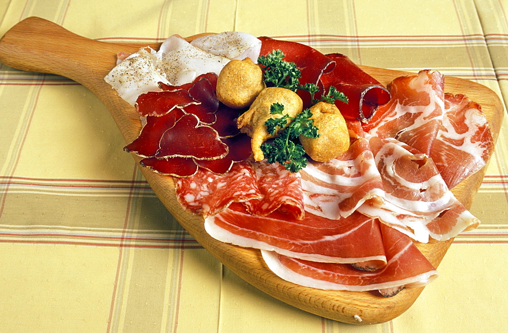 Chopping board with salami, Al Frodolfo restaurant, Santa Caterina Valfurva, Lombardy, Italy