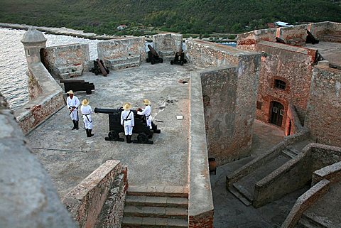 The shooting of the gun, Castle of Morro (Castillo del Morro), Santiago de Cuba, Cuba, West Indies, Central America