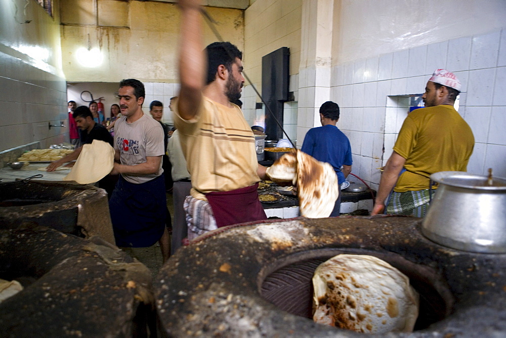 Preparation of typical arab bread, Yemenite restaurant, Sana'a, Yemen, Middle East  