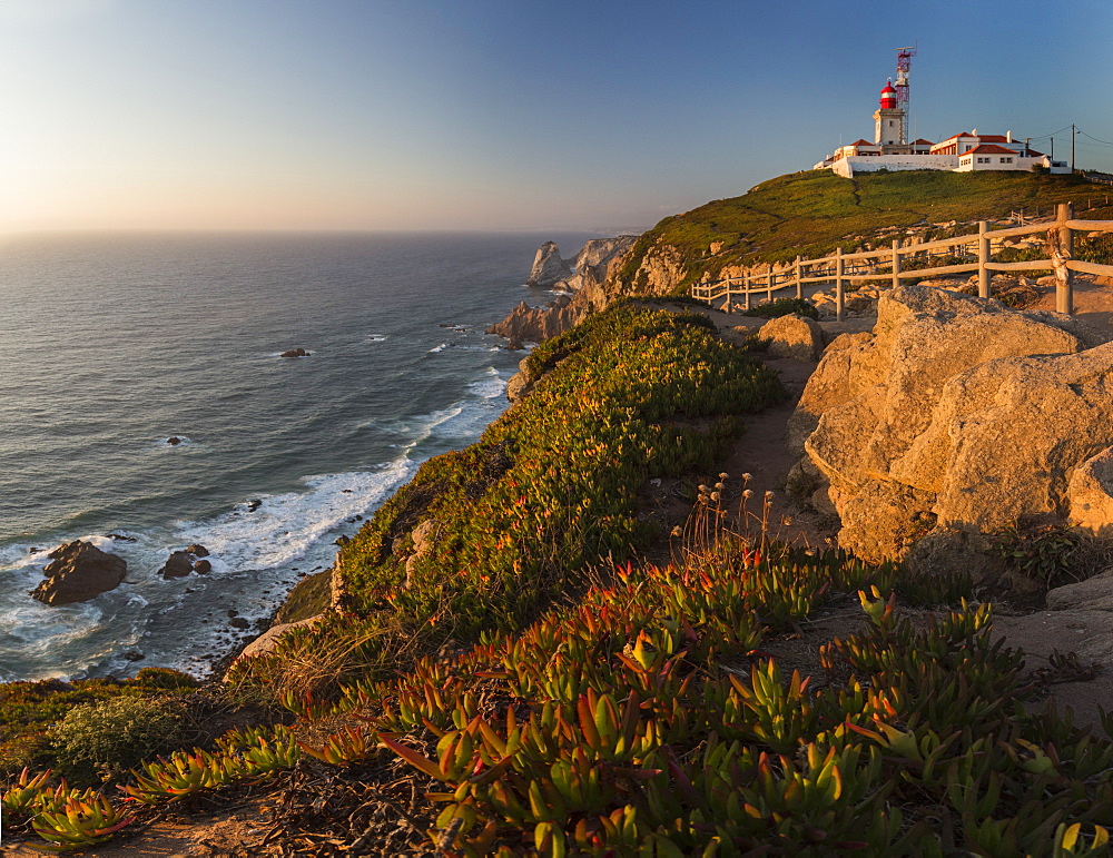 Panoramic view of the cape and lighthouse of Cabo da Roca overlooking the Atlantic Ocean at sunset, Sintra, Portugal, Europe