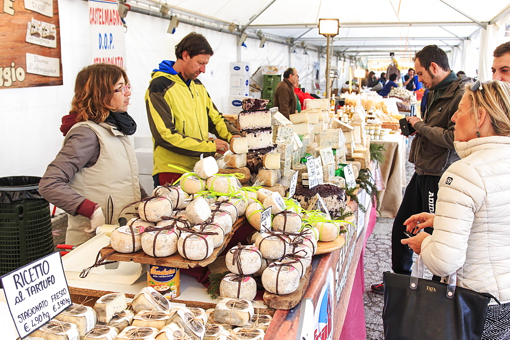 Tourists in front of a cheese vendor at the Moncalvo Truffle fair, Moncalvo, Piedmont, Italy, Europe