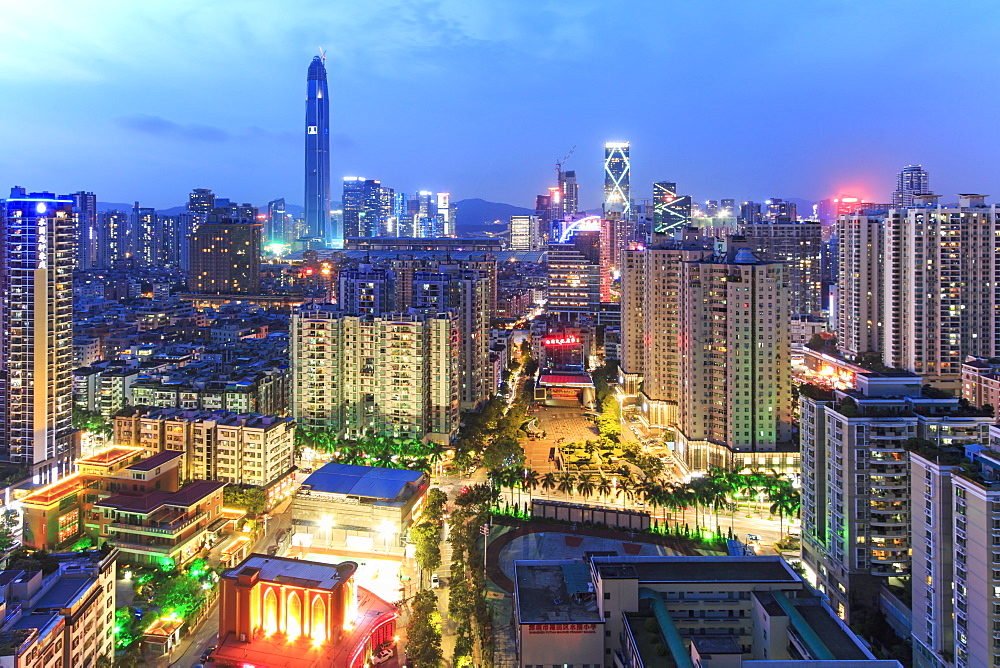 Shenzhen skyline at twilight with the tallest building of the city on background: the Ping An IFC, China