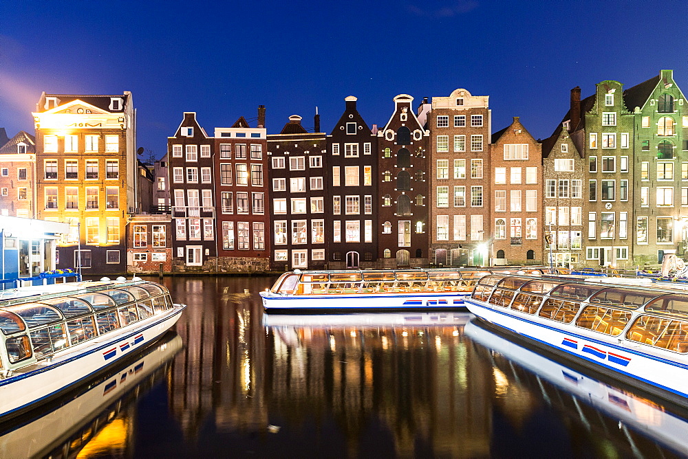 Houses reflecting on canal, Amsterdam, Netherlands, Europe