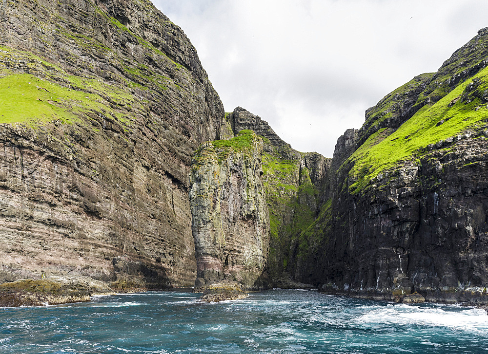 The cliffs, sea stacks and arches at Vestmanna, one of the big attractions of the Faroe Islands  The island Streymoy, one of the two large islands of the Faroe Islands  in the North Atlantic.  Europe, Northern Europe, Denmark, Faroe Islands