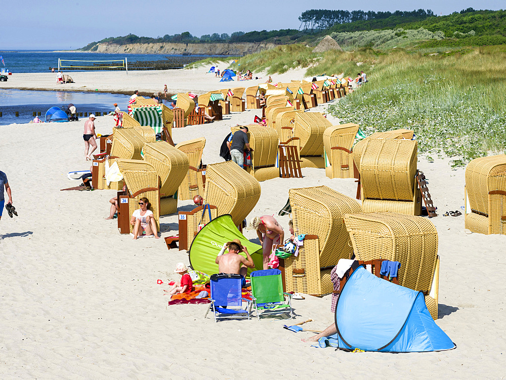 Beach at the Baltic Sea with typical Strandkoerben (beach chairs). Wustrow on Fischland Peninsula. Europe, Germany, West-Pomerania, June