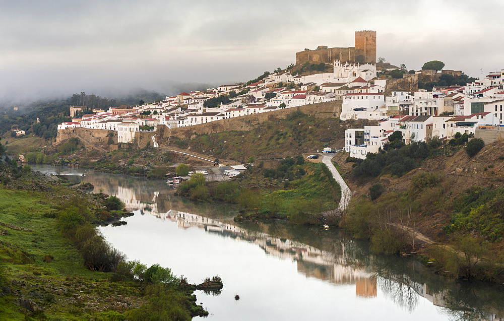 Mertola on the banks of Rio Guadiana in the  Alentejo.  Europe, Southern Europe, Portugal, March