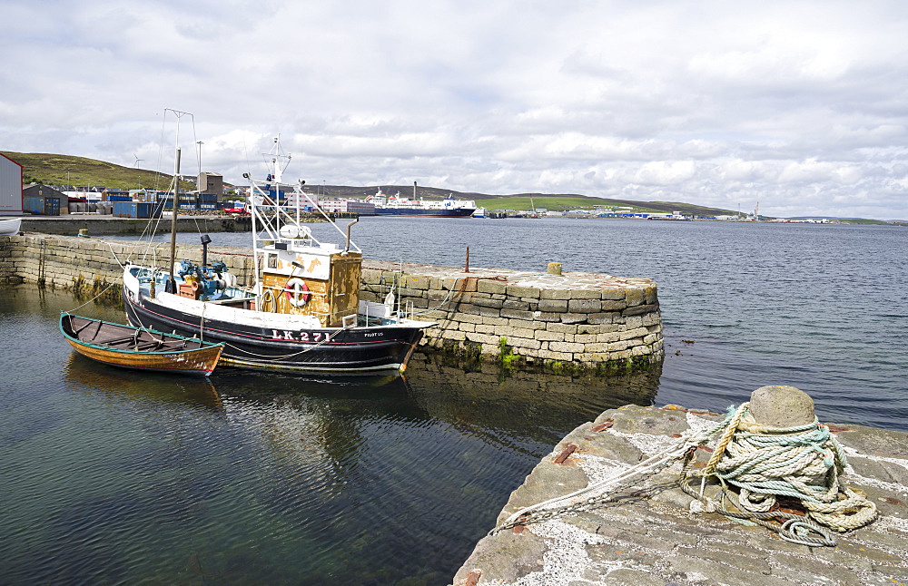 Lerwick, the capital of the Shetland Islands in the far north of Scotland.  Historic Hays Dock and Hays Quay, old fishing boat, the new commercial harbour in the background. Europe, northern europe, great britain, scotland, Shetland Islands, June