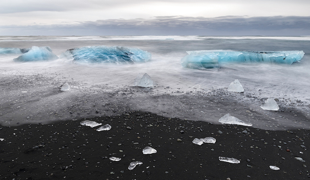 icebergs on black volcanic beach.  Beach of the north atlantic near the glacial lagoon Joekulsarlon and glacier Breithamerkurjoekull in the Vatnajoekull NP.europe, northern europe, iceland,  February