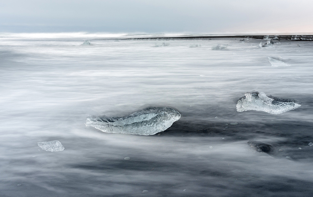 icebergs on black volcanic beach.  Beach of the north atlantic near the glacial lagoon Joekulsarlon and glacier Breithamerkurjoekull in the Vatnajoekull NP.europe, northern europe, iceland,  February