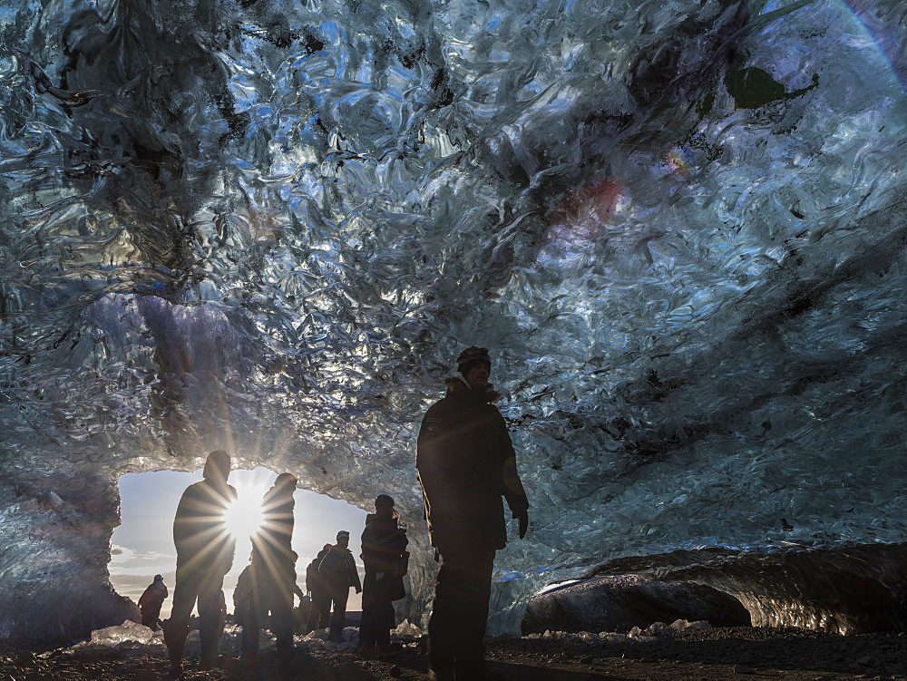 Ice cave in the glacier Breidamerkurjoekull in Vatnajoekull National Park. Tourists at the entrance to the Ice Cave. europe, northern europe, iceland,  February