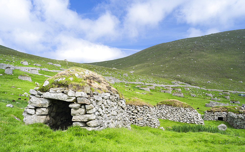 The islands of St Kilda archipelago in Scotland. Island of Hirta , Traditonal Cleit, a dry stone bothy used for storing food and other materials. It is one of the few places worldwide to hold joint UNESCO world heritage status for its natural and cultural qualities. Europe, Scotland, St. Kilda, July