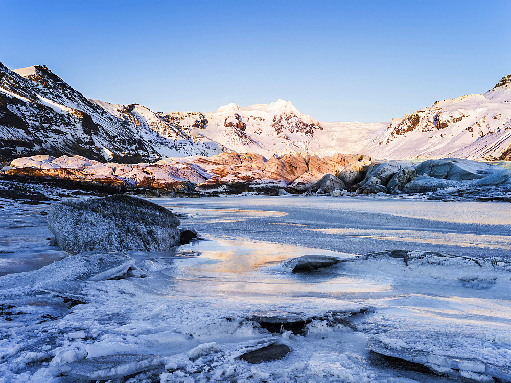 Svinafellsjoekull glacier in Vatnajoekull NP during Winter, view of Mt. Hrutsfjall during sunset. europe, northern europe, scandinavia, iceland,  February