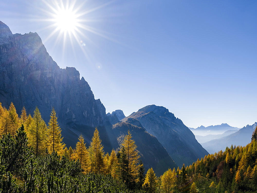 Valle Corpassa in the  Civetta - Moiazza mountain range in the dolomites of the Veneto.  In the background the peaks of Pale di San Martino.  The Dolomites of the Veneto are part of the UNESCO world heritage. Europe, Central Europe, Italy, October