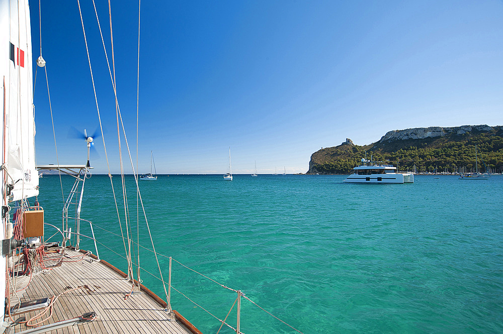 Boat and Sella del Diavolo, Cagliari, Sardinia, Italy, Europe