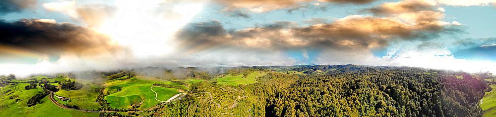 Huka Falls, New Zealand. Panoramic aerial view of beautiful waterfalls and countryside at sunset.