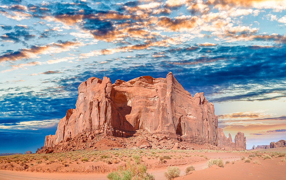 Panoramic view of Monument Valley mountain and road across national park.