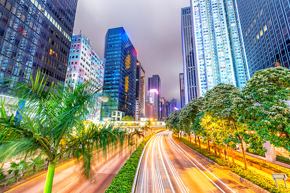 Hong Kong buildings and traffic. City skyline at night. Business concept.