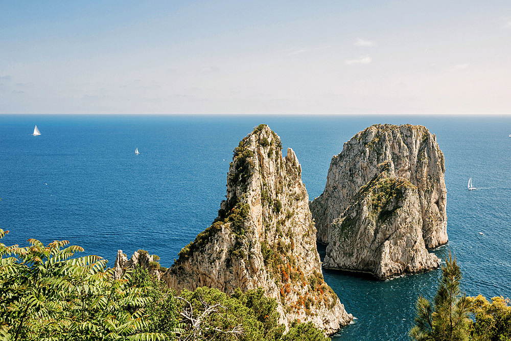 View at sea and Faraglioni rocks in the sunlight, Capri, Italy, Europe