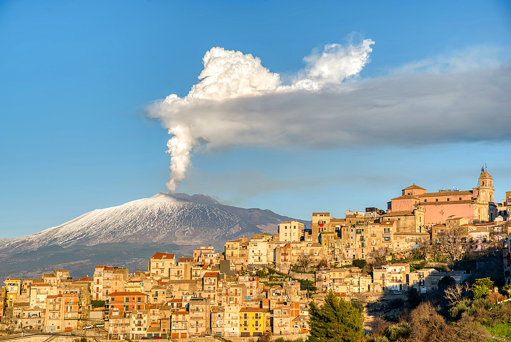 Cityscape of Centuripe and in the background the erupting Volcano Etna, Sicily, Italy, Europe?