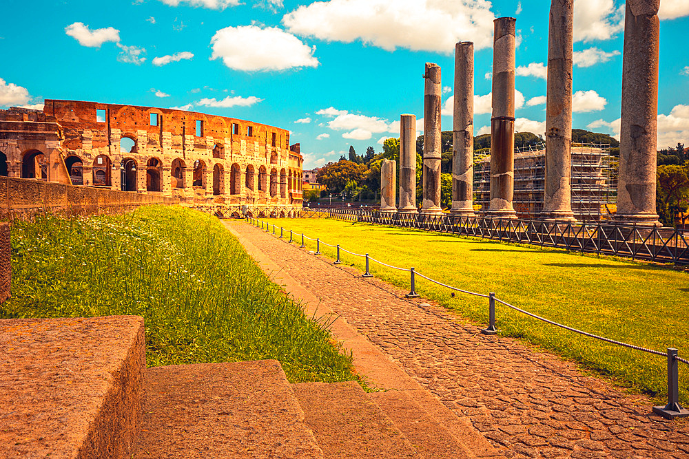 Roman roads upon the Palatine Hill with beautiful view on Coliseum in background, Rome, Lazio, Italy, Europe