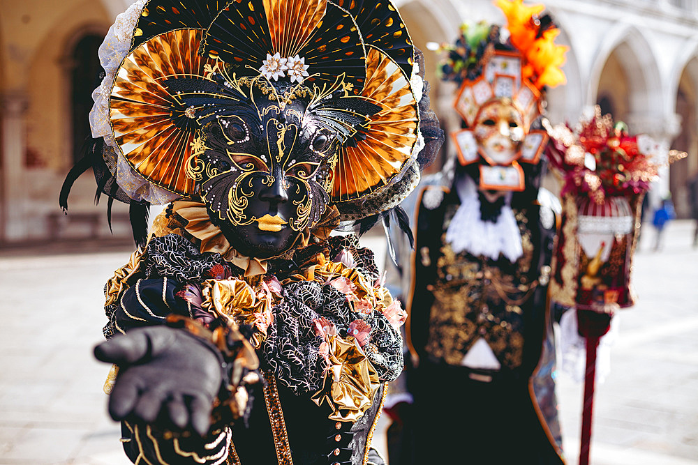 Portrait of a couple with beautiful masks in Venice, Veneto, Italy, Europe