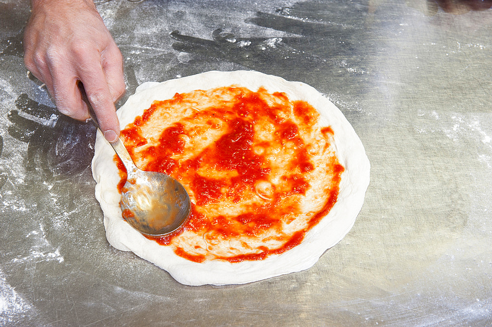 The preparation of a classic Margherita pizza, Italy, Step 07