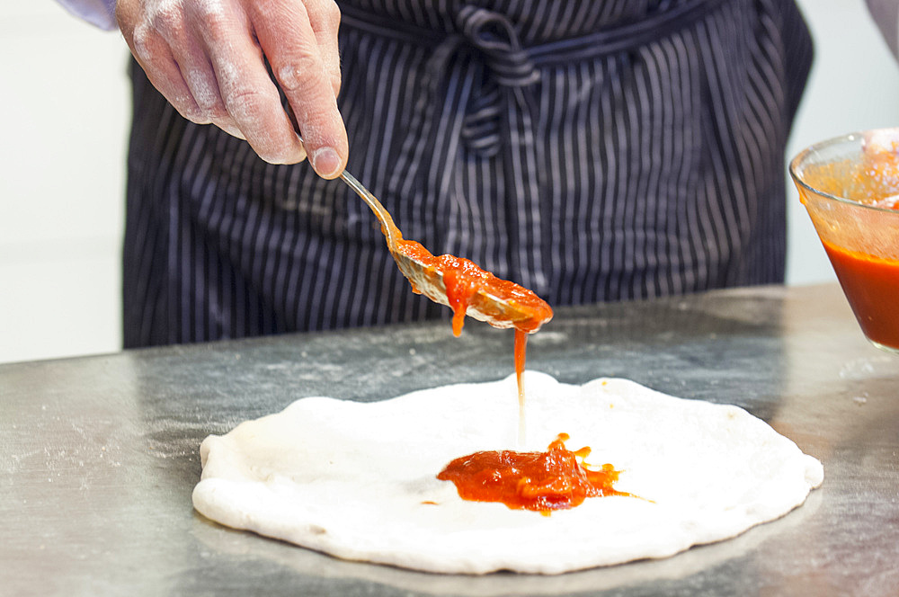 The preparation of a classic Margherita pizza, Italy, Step 06