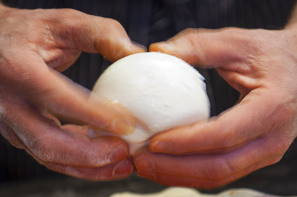 The preparation of a classic Margherita pizza, Italy, Step 12