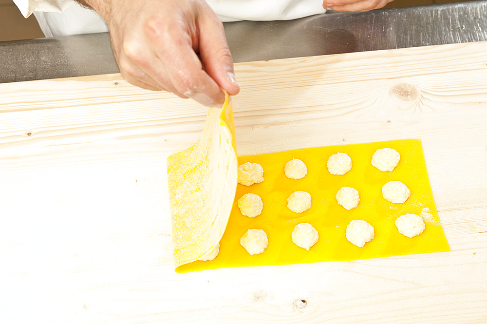 Making Tortelli from fresh pasta by hand. Italy