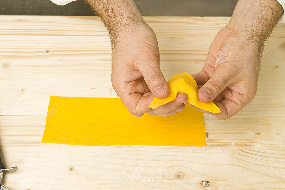 Making Tortelli from fresh pasta by hand. Italy