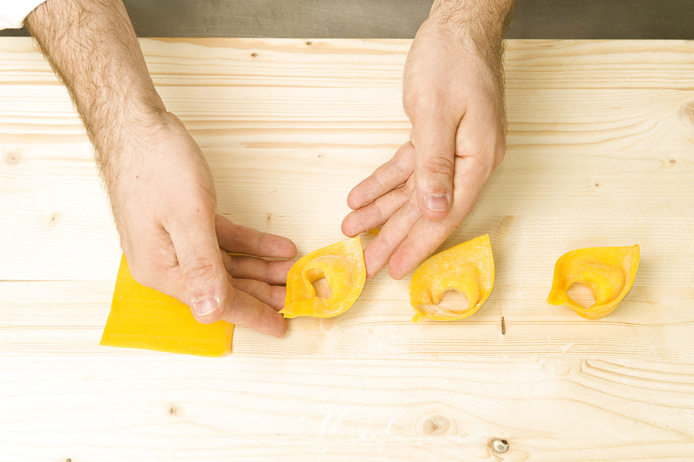 Making Tortelli from fresh pasta by hand. Italy