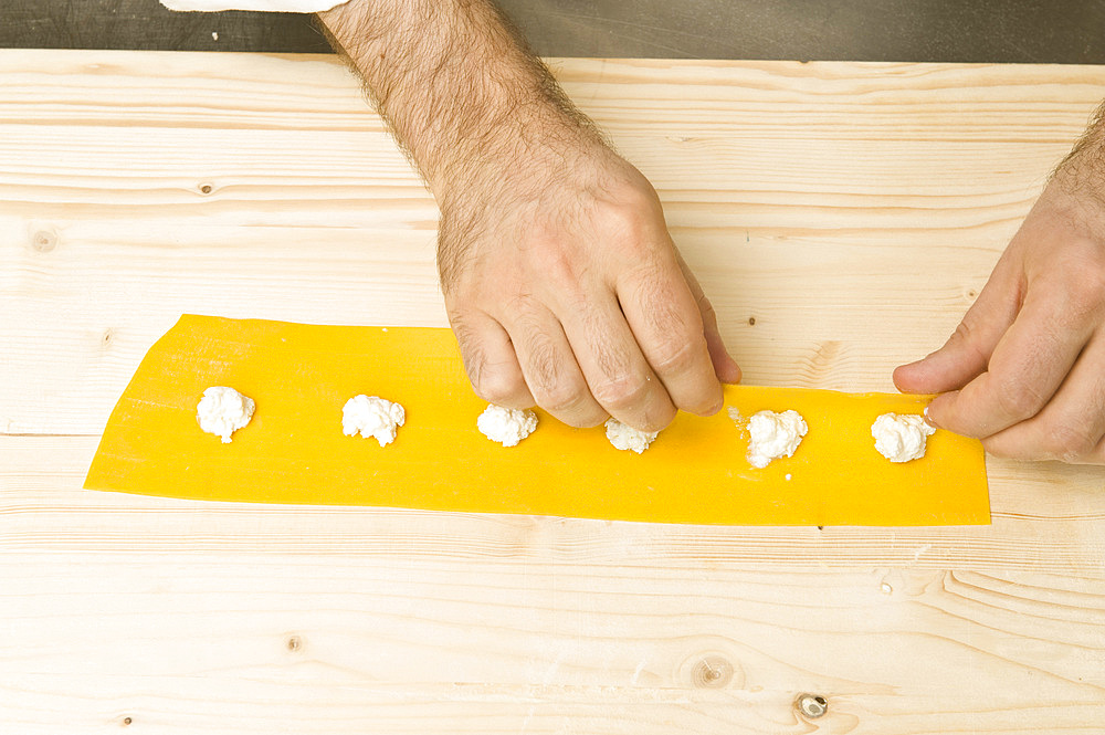 Making Tortelli from fresh pasta by hand. Italy