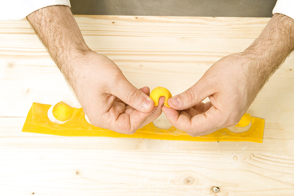 Making Tortelli from fresh pasta by hand. Italy