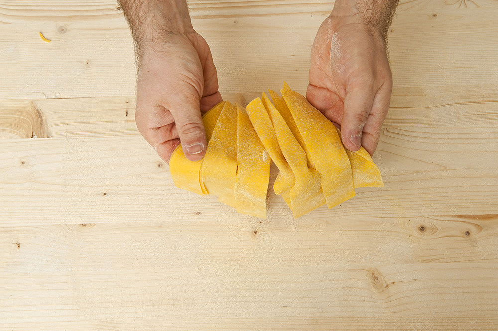 Making Farfalle out of fresh pasta by hand. Italy