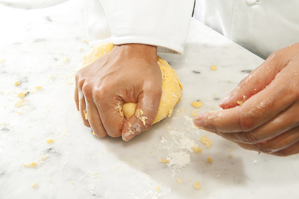 Working with fresh egg pasta by hand. Italy