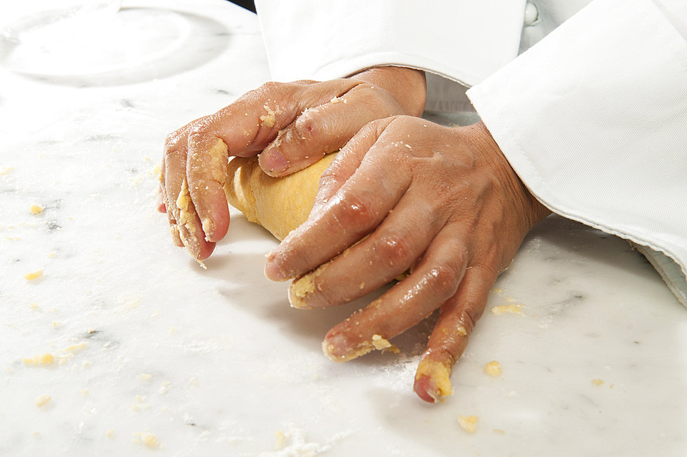 Working with fresh egg pasta by hand. Italy