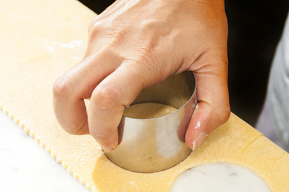 Making fresh tortelli by hand. Italy