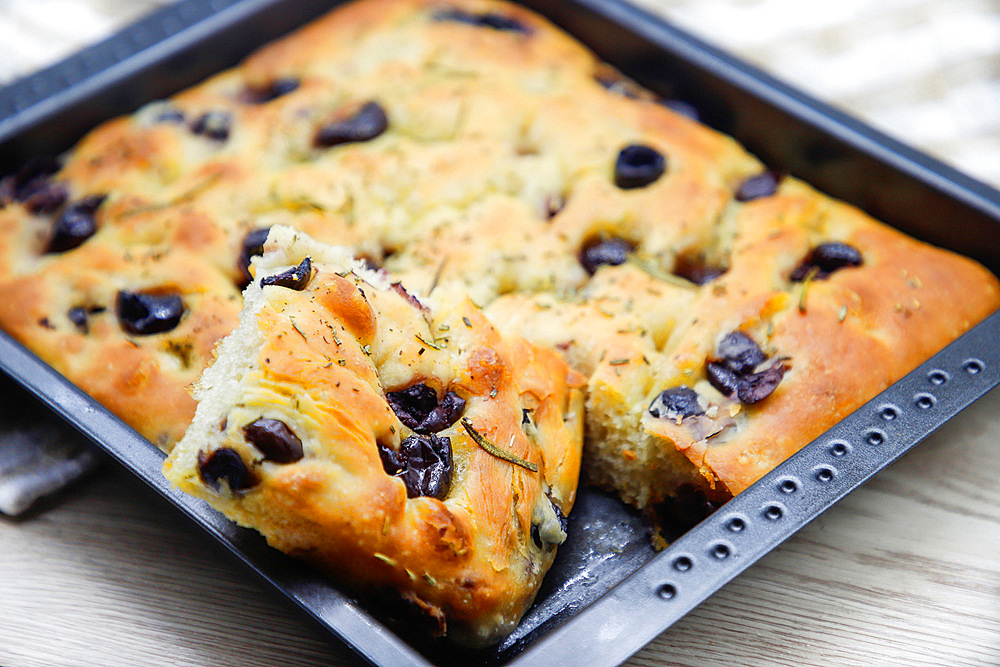 Focaccia, flat bread, with black olives, Italy, Europe