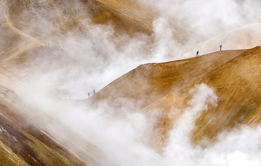 Hikers in the geothermal area Hveradalir in the mountains Kerlingarfjoell in the highlands of Iceland. Europe, Northern Europe, Iceland, August