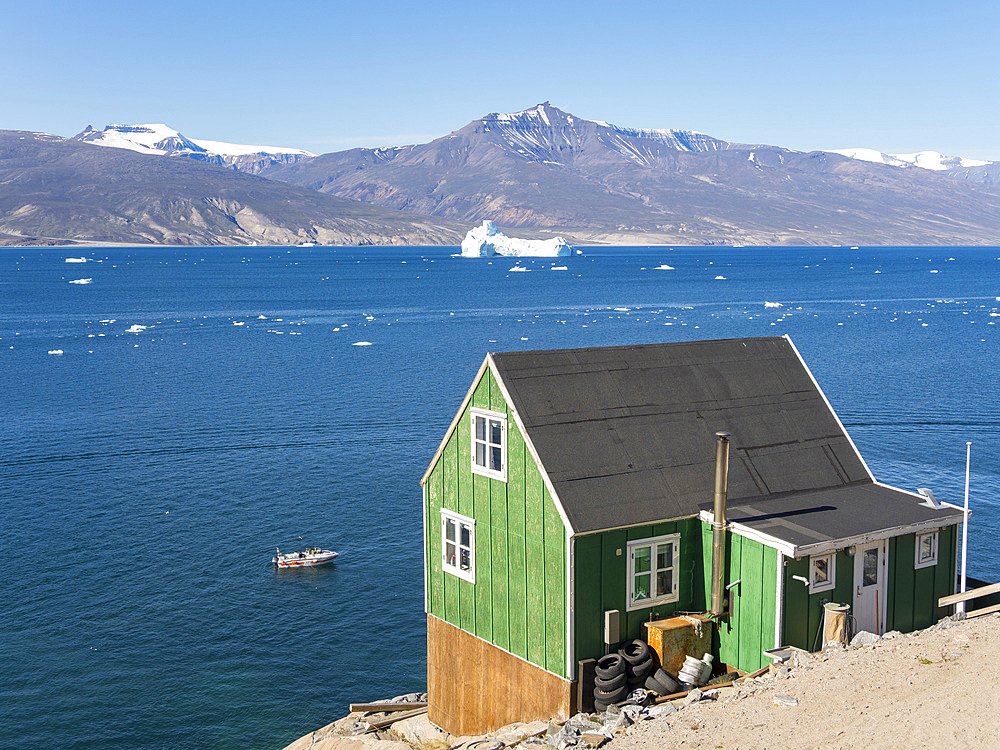 The town Uummannaq in the north of West Greenland, located on an island in the Uummannaq Fjord System. America, North America, Greenland