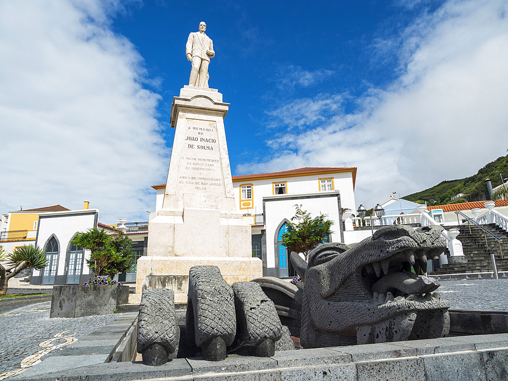 Monument commemorating Joao Inacio de Sousa at square Joao Pereira. Velas, the main town on the island. Sao Jorge Island, an island in the Azores (Ilhas dos Acores) in the Atlantic ocean. The Azores are an autonomous region of Portugal. Europe, Portugal, Azores