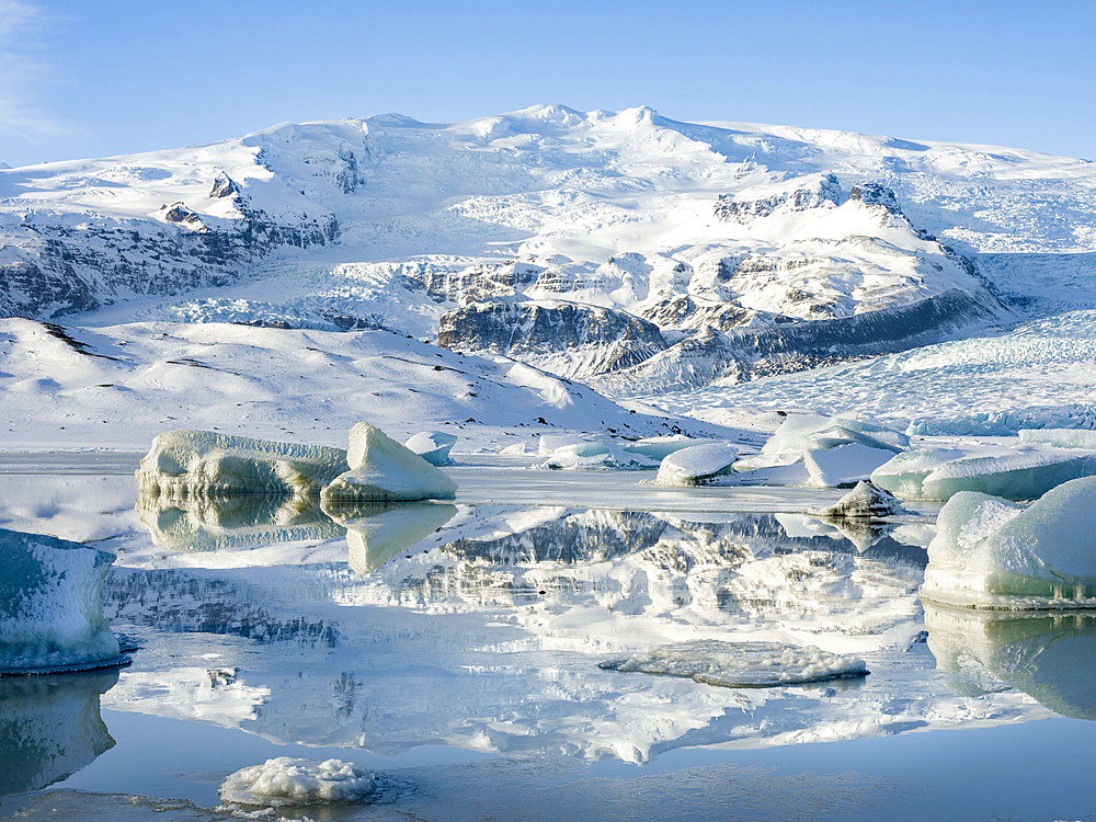 Glacier Fjallsjoekull and frozen glacial lake Fjallsarlon in Vatnajokull NP during winter. Europe, Northern Europe, Iceland, February