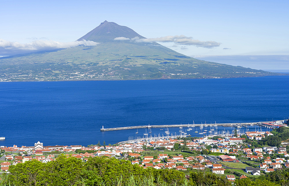 Horta, the main town on Faial. Island and vulcano Pico in the background. Faial Island, an island in the Azores (Ilhas dos Acores) in the Atlantic ocean. The Azores are an autonomous region of Portugal.