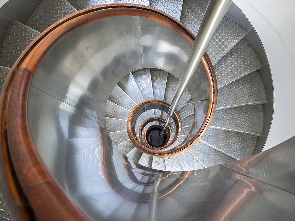 Spiral stairs in the lighthouse in the Nature Reserve Vulcao dos Capelinhos. Faial Island, an island in the Azores (Ilhas dos Acores) in the Atlantic ocean. The Azores are an autonomous region of Portugal.