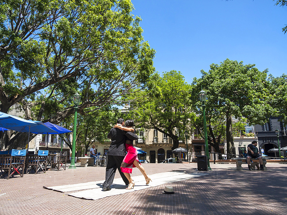 Plaza Dorrego in quarter San Telmo. Professional tago dancers performing for guests of a cafe. Buenos Aires, the capital of Argentina. South America, Argentina, November