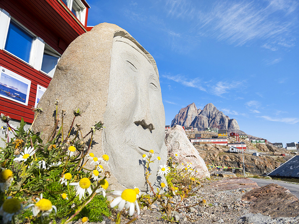 Sculpture of head and face in tradtional style. Small town Uummannaq in the north of west greenland. America, North America, Greenland, Denmark