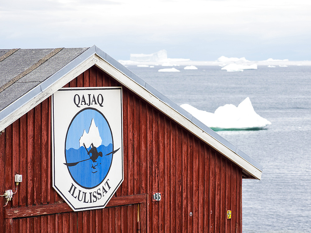 Boat shed of the Qajaq Club in Ilulissat. Town Ilulissat at the shore of Disko Bay in West Greenland, center for tourism, administration and economy. The icefjord nearby is listed as UNESCO world heritage. America, North America, Greenland, Denmark