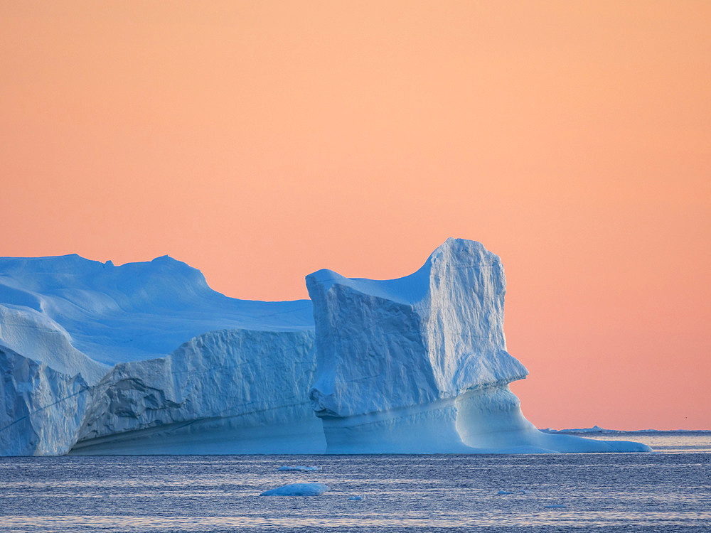 Icebergs in the Disko Bay. The Inuit village Oqaatsut (once called Rodebay) located in the Disko Bay. America, North America, Greenland, Denmark