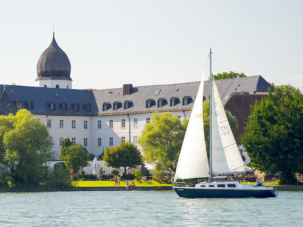 Monastery Frauenwoerth on the island Fraueninsel. Lake Chiemsee in the Chiemgau. The foothills of the Bavarian Alps in Upper Bavaria, Germany