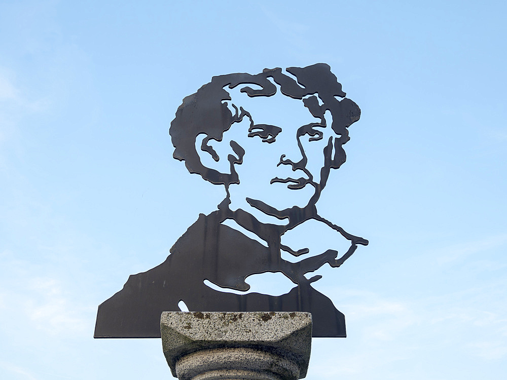 Monument commemorating Ludwig II in the harbour of Prien. Lake Chiemsee in the Chiemgau. The foothills of the Bavarian Alps in Upper Bavaria, Germany